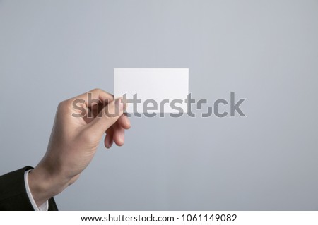 people is holding business card in hand