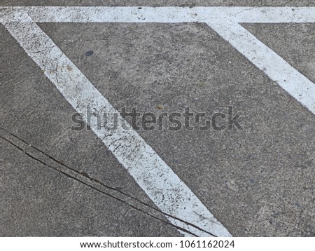Abstract : closeup of traffic sign white line paint for car parks on concrete floor background and texture with copy space 