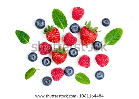 Fresh berries isolated on white background, top view. Strawberry, Raspberry, Blueberry and Mint leaf, flat lay Royalty-Free Stock Photo #1061164484