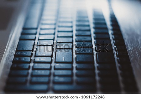 Modern laptop keyboard.  Technology and internet concept background. Engineer workplace.
