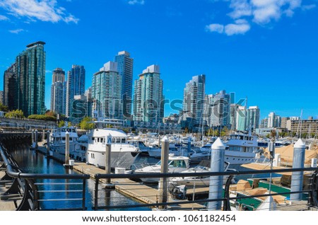Modern Skyscrapers Port with Luxury Yachts in Vancouver, BC on a Clear and Beautiful Day