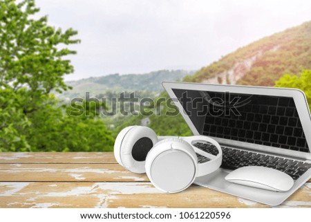 Headphones with laptop on table