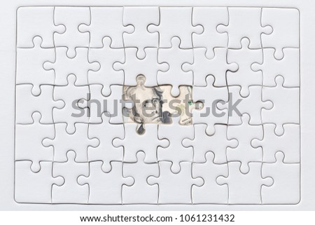Missing jigsaw puzzle pieces on USA dollar background, Business solution concept