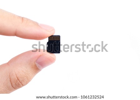 Small Flash card in hand isolated on white background
