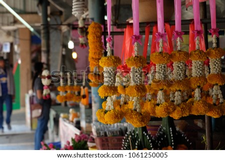 Selling garlands in Thailand market.