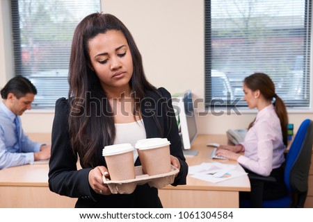 Fed Up Female Intern Fetching Coffee In Office