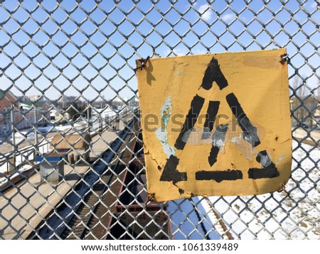 High Voltage Sign. Danger symbol. High voltage sign on rail