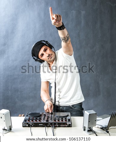 DJ with mixer is working , photo with copyspace