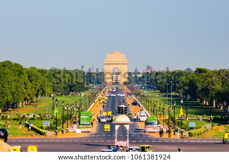 Rajpath with India Gate war memorial in background situated in New Delhi, India. One of the most efficiently built road in the capital of India. Rajpath road connects India Gate & Rashtrapati Bhavan.  Royalty-Free Stock Photo #1061381924