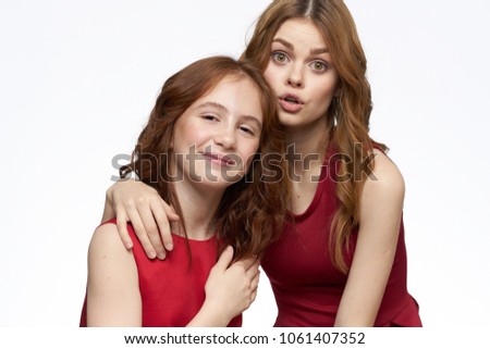   women embrace girl on isolated background                             