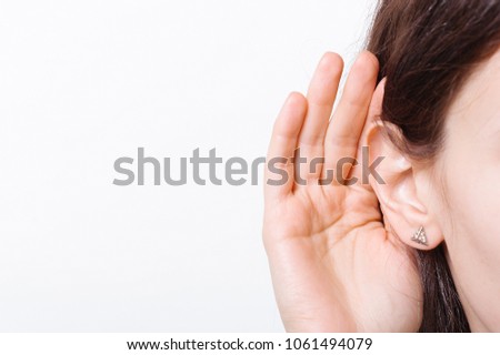 Young woman with symptom of hearing loss isolated on white Royalty-Free Stock Photo #1061494079