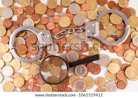 Picture of a Business Money Concept Idea Conis and Handcuffs