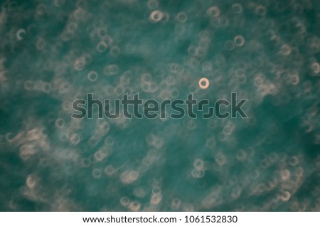Abstract blur blue bokeh water texture background