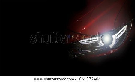 Close up shot of headlight in luxury 
red car background with copy space. Modern and expensive sport car concept