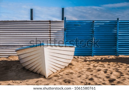 boat in the bathing beach, white and blue background
