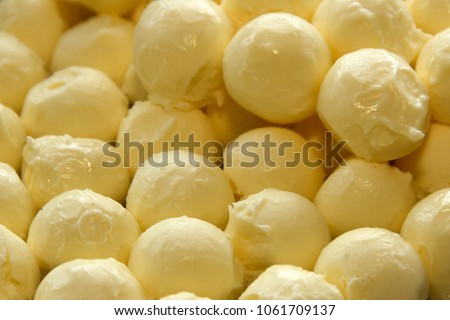 balls of fresh natural butter Royalty-Free Stock Photo #1061709137