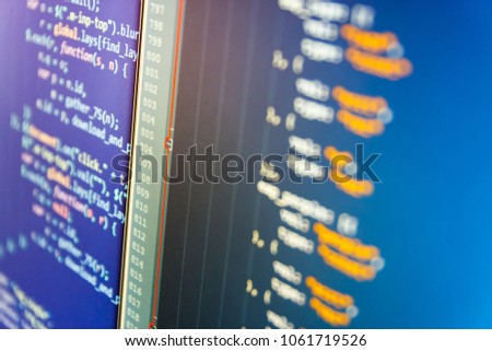Software development. Software source code. Programming code typing. JavaScript code in text editor. Abstract IT technology background.  IT business company. 