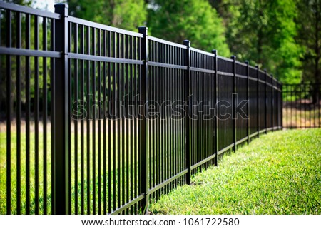 Black Aluminum Fence  Royalty-Free Stock Photo #1061722580