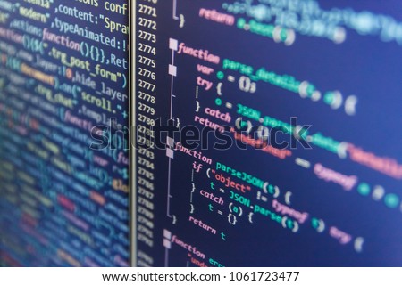 Information technology website coding standards for web design Hacker breaching net security. Website codes on computer monitor. Abstract screen of software. JavaScript code in text editor. 