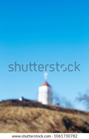 
blurred church on a hill