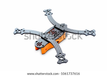 The beginning of the racing drone assembly. Durable frame of an unmanned aerial vehicle, made of carbon fiber and 3d printing, isolated on a white background.