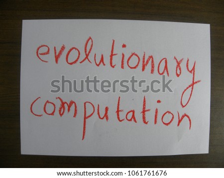 Text evolutionary computation hand written by red color oil pastel on paper