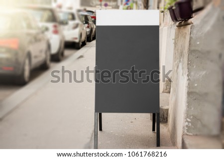 Empty Blackboard Advertisement mock-up on sidewalk
