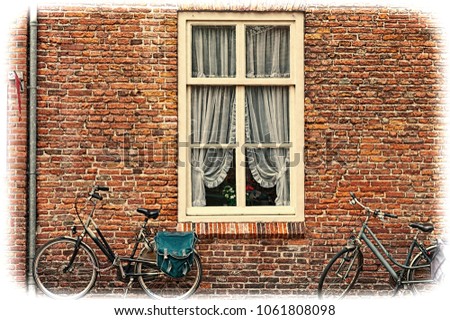 White window with Curtain and retro bicycles in the Dutch City. Bikes leaning against the red brick wall in Amersfoort. Vintage style toned picture