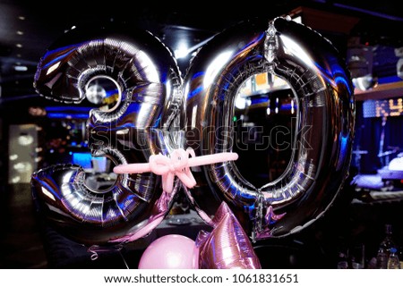 Closeup photo of balloons on birthday in club