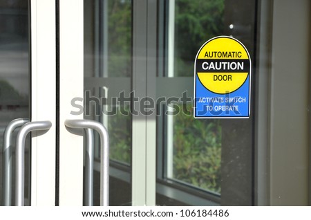Automatic caution door sign