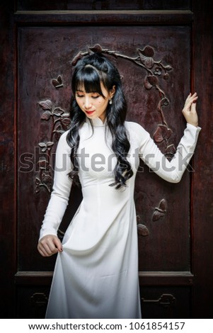 Beautiful woman in Ao Dai ,White Traditional dress of Vietnam