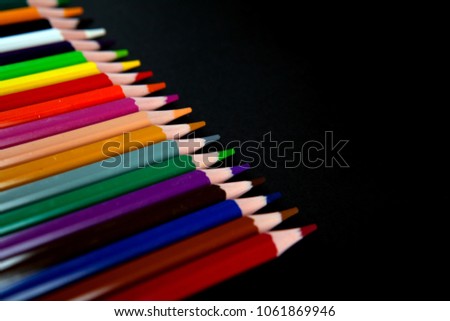 Color pencils on black background