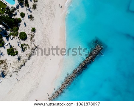 Drone photo of pier in beach in Grace Bay, Providenciales, Turks Royalty-Free Stock Photo #1061878097