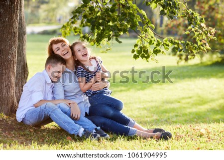 Mother and children having fun in the park