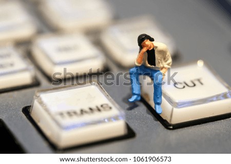 Miniature people : businessman sitting on switcher control of Television Broadcast,color buttons