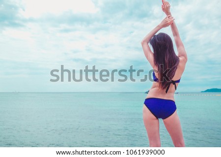 Beautiful bikini Asian girl on the beach.