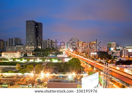 Aerial view of Bangkok Highway and building at downtown area at dusk