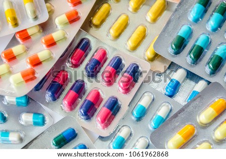pharmaceuticals antibiotics pills medicine /colorful antibacterials pills on  white background /capsule pill medicine  Royalty-Free Stock Photo #1061962868
