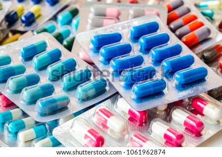 pharmaceuticals antibiotics pills medicine /colorful antibacterials pills on  white background /capsule pill medicine  Royalty-Free Stock Photo #1061962874