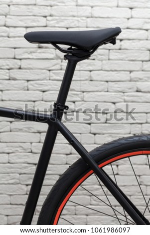 New modern road bicycle on white textured background.