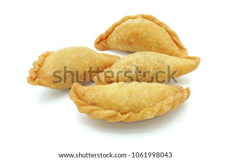 Thai snack Pun Sib, Small fried puff, Isolated on white background cutout with clipping path Royalty-Free Stock Photo #1061998043