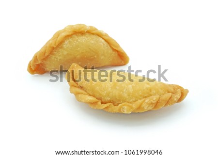 Thai snack Pun Sib, Small fried puff, Isolated on white background cut out with clipping path Royalty-Free Stock Photo #1061998046