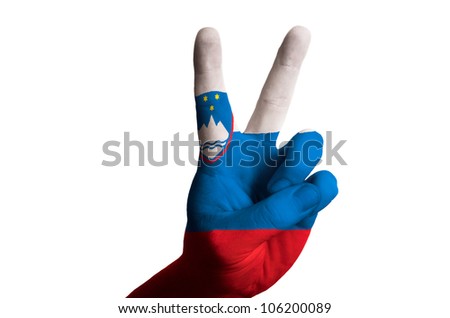Hand with two finger up gesture in colored slovenia national flag as symbol of winning,  - for tourism and touristic advertising, positive political, cultural, social management of country