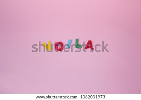 Colorful letters on pink background