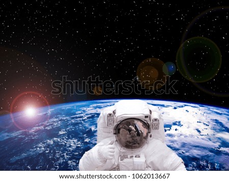 Astronaut posing in space. The elements of this image furnished by NASA.
