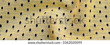Yellow sport jersey clothing fabric texture and background with many folds