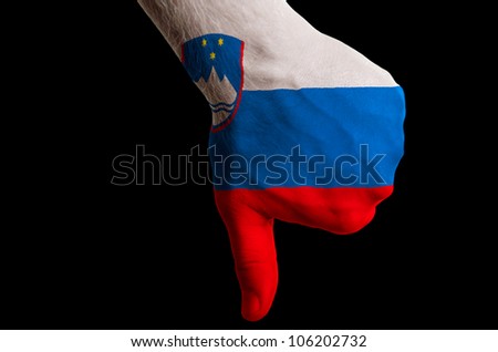 Hand with thumbs down gesture in colored slovenia national flag as symbol of negative political, cultural, social management of country