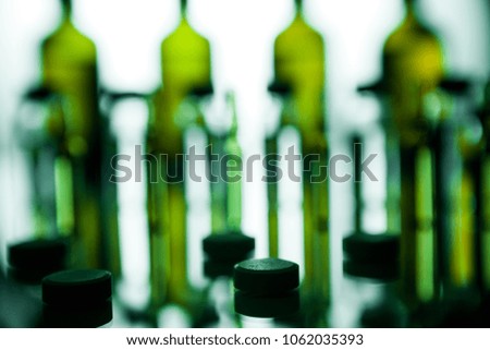 Group object of liquid medicinal agent in limpid glassware in medical laboratory. Group of ampoules with a transparent medicine in medical laboratory