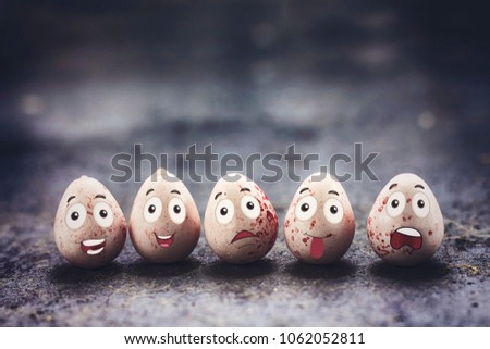 delicious pink chocolate easter eggs with funny cartoon face , holiday concept