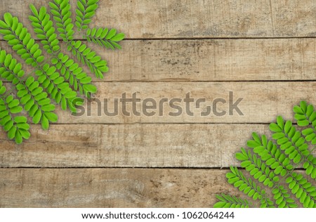 leaves on wooden floor. free space for word completion or other.